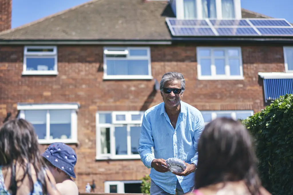 Grandfather playing with grandchildren in a Doncaster home